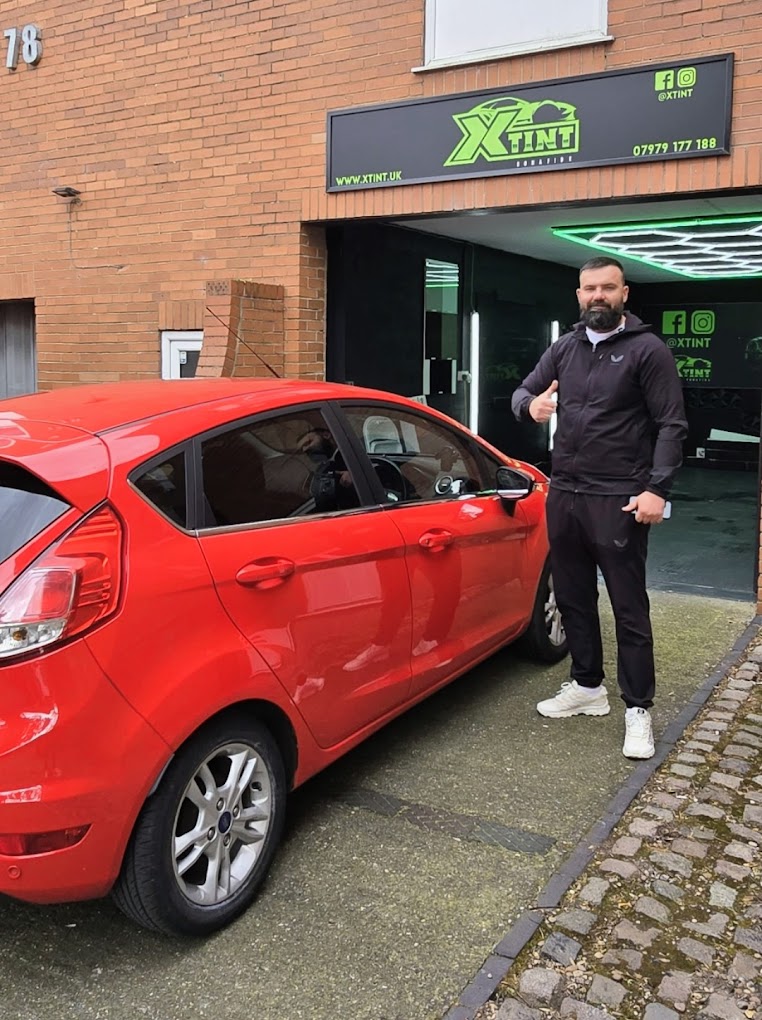 Cezar, owner of XTINT, outside the Nottingham studio