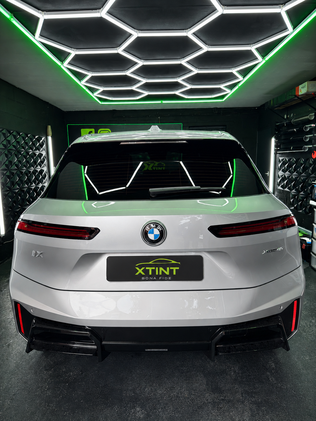 Tinted Audi under hexagon studio lighting